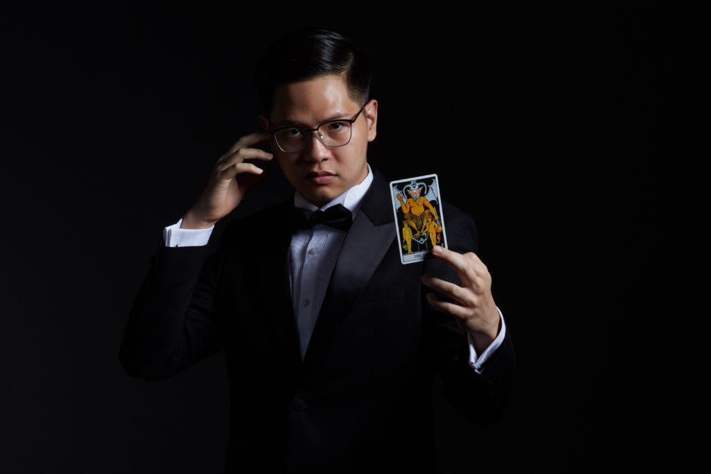 quantamentalist, man holding playing card
