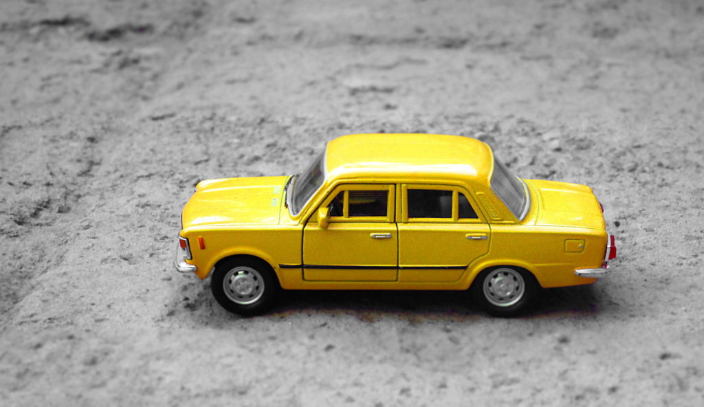yellow toy car illustrating how human+AI collaboration works to operate a semiautonomous vehicle